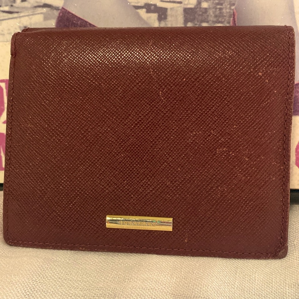 Burberry bifold leather wallet with some fabric plaid inside in GUC